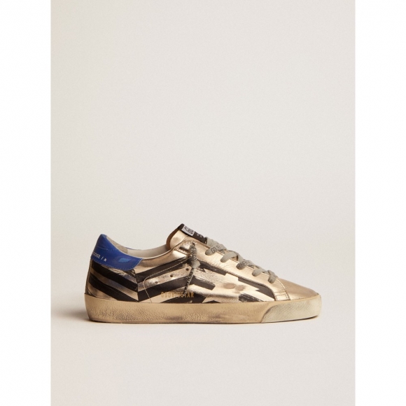 Super-Star sneakers in platinum-colored laminated leather with black flag print and red and blue heel tab